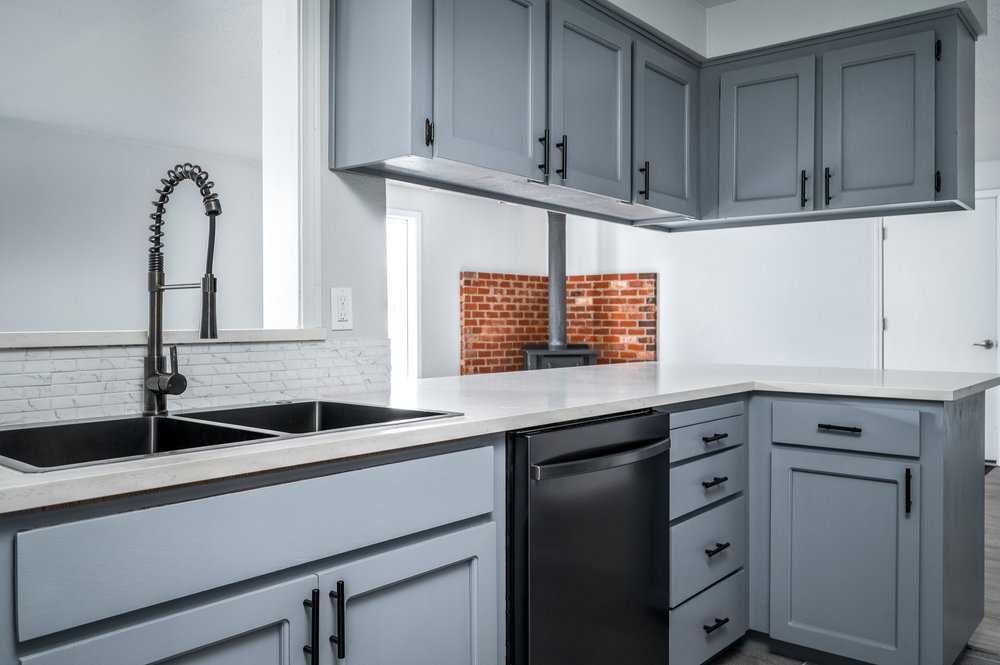 Remodeled kitchen with gray cabinetry